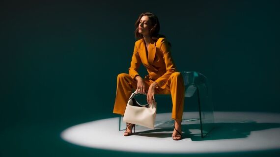 Neiman Marcus Mustard Power Suit - Sitting On Ghost Chair by Fiam Italia